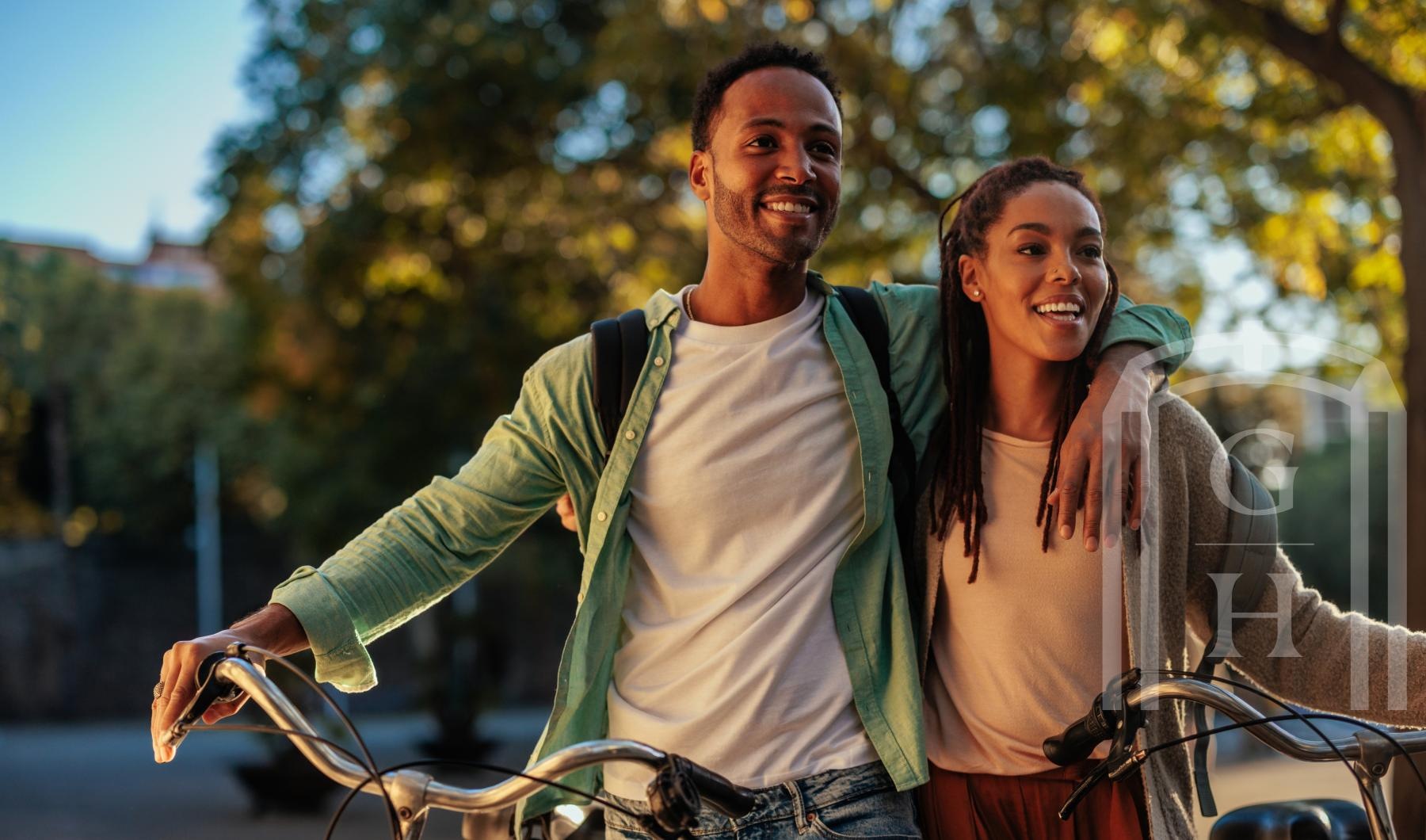 a man and woman riding a bike